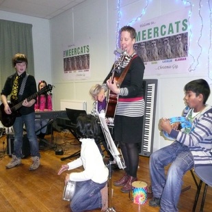 Karen Jones playing music with the children
