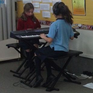 Children learning to play music